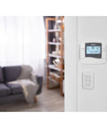 Non Programmable Thermostat With Backlit Display For Easy Readout Of Room Temperature And Outdoor Temperature on wall