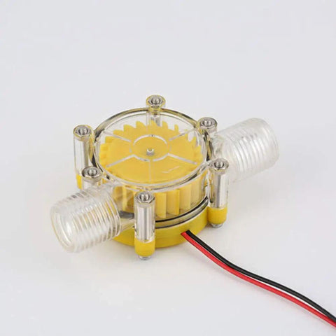 Water Turbine Micro Hydroelectric Power Generator For DIY Off Grid Charging LED Lighting And Devices DC Up To Eighty Volts Ten Watt Output No Internal Regulator Great For Charging Small Batteries And Phones, transparent plastic housing, side view.