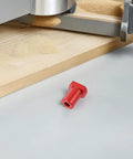 Close-up of red aluminum part from Six Piece Aluminum Workbench Dog Clamps With Low Profile Design For Desktop Tenon In Woodworking.