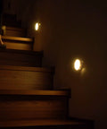 Cordless Motion Sensor LED Night Light illuminating stairs with auto on off, 120 degree coverage, rechargeable indoor lighting.
