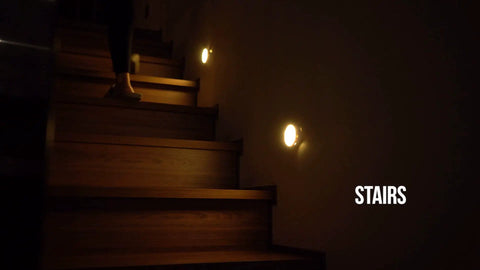 Cordless Motion Sensor LED Night Light illuminating stairs with auto on off, 120 degree coverage, rechargeable indoor lighting.
