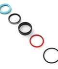 Five components from the Beefed Up Hydraulic Seal Kit For Lift Cylinder For Ford New Holland 7106 7108 7308 Case L130