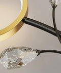 Close-up of Top Shelf Modern Wall Sconce Packed With Crystal Trim And Slick Three Color Dimmable Lighting For Master Bedrooms Living Rooms And Hallways Wire Drawn Metal Body.