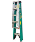 A green and silver folding ladder standing vertically, against a white background, with safety labels visible.