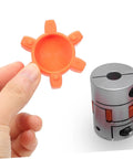 Close-up of orange rubber spider insert for Flexible Jaw Coupling Insert With Rubber Spider For Vibration Dampening In CNC Machines