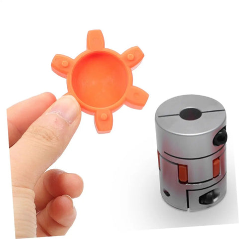 Close-up of orange rubber spider insert for Flexible Jaw Coupling Insert With Rubber Spider For Vibration Dampening In CNC Machines