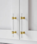 Five Pack Gold Acrylic Drawer Pulls With Brushed Brass Base, Three And Three Quarters Inch Center Hole on white cabinet doors