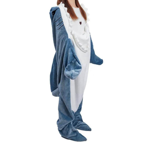 Person wearing Cozy Shark Blanket Hoodie For Adults Wearable Sleeping Bag With Fin And Tail Flap Design, standing in shark costume.