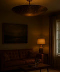 Luxury Handcrafted Brass Pendant Light, Vintage Dome Ceiling Fixture illuminating a cozy living room setting.