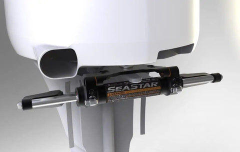 Close-up of Seastar Classic Tilt Hydraulic Steering Kit Without Hoses For Boats HK6400TC-3 installed on outboard motor.