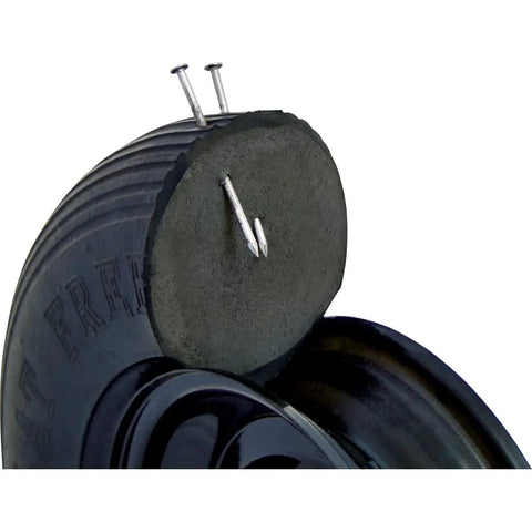 Never Flat 8 Inch Wheelbarrow Tire With Ribbed Tread, Solid Polyurethane Wheel, showing puncture resistance with nails, 16 Inch Wheel