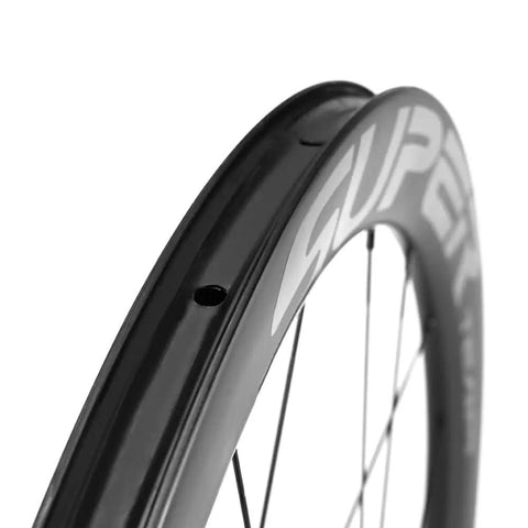 Close-up of Carbon Disc Wheel 50T 28 Tubeless 700C Road Bike Wheel For Shimano Thru Axle 12x100 To 12x142 Lightweight Yet Strong Carbon Rim