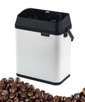 Straight Up Killer Electric Portafilter Cleaner Knock Box Featuring 58mm Vibration Mode For Everyday Baristas Stainless Steel Used Coffee Ground Catcher Tray White Design next to coffee beans