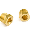 Two brass NPT reducer adapters, 1/2 in male to 1/4 in female threads, pipe fittings, angled front view.