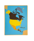 Geography Cabinet With 8 Puzzles And Birch Wood Montessori Maps showing North America puzzle map for classroom learning.