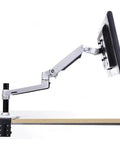 Full Motion Monitor Desk Mount Accommodates 17 To 32 Inch Displays Featuring Rugged Aluminum Spring Arm in use.