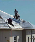 Men installing Heavy Duty Reflective Insulation Roll With Foam Core Covers 400 Square Feet on a rooftop for thermal barrier.