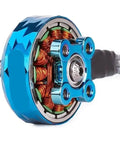 Close-up of V2207.5 brushless motor for RC FPV freestyle drones, blue housing, visible copper coils, durable build.