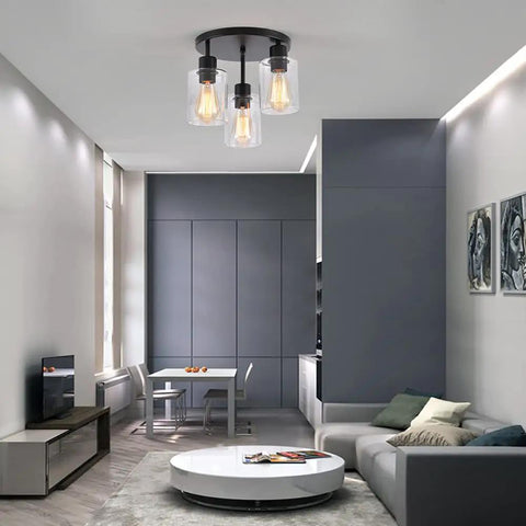 Three Light Industrial Farmhouse Black Matte Ceiling Light Fixture With Clear Glass Shades Semi Flush Mount in modern living area