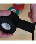 Person using Bulk 48 Roll Carton Electrical Tape Black Waterproof Heavy Duty Pro Grade Vinyl Self Adhesive PVC Wire Insulation