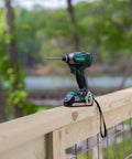 18V MultiVolt Cordless Triple Hammer Impact Driver Kit on fence, One Quarter Inch Hex Chuck, 1,832 in-lbs torque tool outdoors