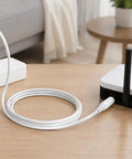 Male To Female Power Extension Cord With Rock Solid Molded Grip Housings For Routing Existing Power Cable And Getting That Long Run on wooden table.