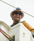 Worker with hard hat and safety gear using Power Packed 3200 mAh USB C Portable Battery For Hard Hat Cooling Fans And USB Devices