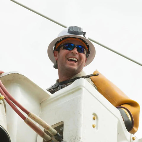 Worker with hard hat and safety gear using Power Packed 3200 mAh USB C Portable Battery For Hard Hat Cooling Fans And USB Devices