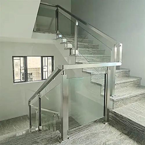 Stainless Steel 304 Railing Post Kit For Outdoor Decks And Stairs Featuring Adjustable Mounts And A Brushed Silver Finish Fit For 10 To 12 Mm Glass Panels Bringing Rock Solid Protection And Top Tier Modern Vibes installed on a stairway with glass panels.