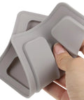Toaster Protector Cover for 2 Slice Toaster Upper Lid 6.25 by 3.93 by 0.70 Inches 2 Pack Dust Debris Guard in hand, flexible material view.