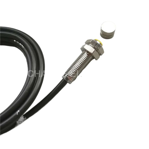 Front view of M8 permanent magnet switch, normally open, 10 mm sensing distance, metal threaded body with black cable.
