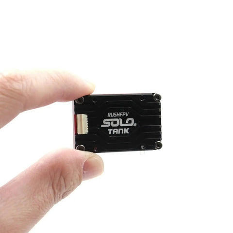 Person holding 5.8G VTX Video Transmitter 1.6W High Power With Built In Microphone compact black CNC shell.
