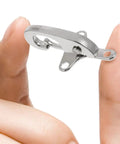 Four Pairs Of Silver Zinc Alloy Web Joint Buckles For Crafts, Built Tough To Beat Wear And Tear, Adjustable Airplane Style Buckles For DIY Projects, Perfect For Belts, Straps, Bags, And Garments. Silver zinc alloy web joint buckle held between fingers