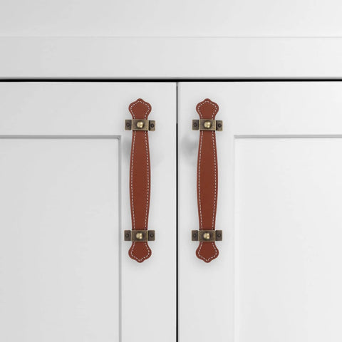 Vintage Leather Trunk Handle Replacement For Cabinets And Drawers Brown Leather Cabinet Pulls installed on white doors
