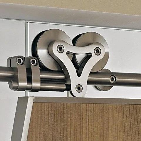Close-up of Apex Stainless Steel Sliding Barn Door Hardware Kit 8 Foot Track Double Door Kit with top mount rollers installed.