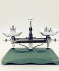 Vintage balance scale with weights on plates