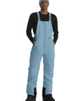 Man wearing Insulated Waterproof Ski Bib Overalls For Men, Bomber Snowboarding Pants With Warm Thick Liner, Haze Blue, Large