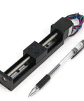 Compact Mini Linear Rail Guide Kit With Lead Screw T6x1 And Nema 11 Stepper Motor beside a pen