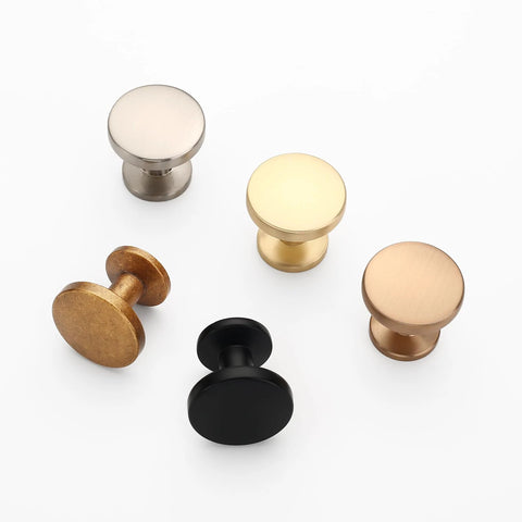 Assorted metallic cabinet knobs including 10 Pack 1-1/5 Inch (30mm) Cabinet Knobs Matte Black For Cabinets, Dresser, And Kitchen Drawers.