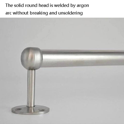 Close-up of heavy duty stainless steel clothes rod for modern closets with welded round head and wall mount