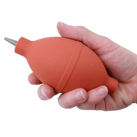 Hand holding Pro Grade Dust Blower For Watch Movements And Small Parts Clean Tool With PVC Nozzle Tip And Bottom Inlet Valve
