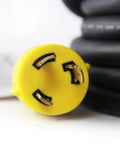 Yellow plug tip of Beefy Locking Generator Power Cord NEMA L6-30P To L6-30R 3x10 Gauge SJOOW Rubber Cable 25 Ft, close-up view
