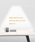 LED Clip On Desk Lamp with Clamp for Home Office Adjustable Swing Arm Touch Control 9W Power 3 Color Modes illuminating a desk