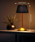 Cordless Metal Desk Lamp With Touch Sensor 3 Way Dimmable LED Table Light Fabric Shade Nightstand Lamp, lit beside a plant