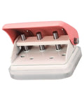 Three Hole Punch Handheld Paper Puncher With Five Sheet Capacity And Alignment Posts, pink and metallic, side view