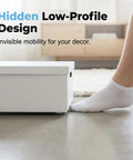 Reliable Peel Stick Mini Caster Wheels White Four Pack No Sweat Furniture Sliders Tool Free Quick Install showing low-profile design in use under a white box