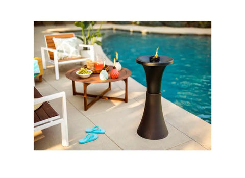 Decorative Glass Table Torch With Durable Fiberglass Wick And Metal Snuffer Creates Cozy Ambience For Dining Or Desk Decor Burns Up To Six Hours Per Fill A Thoughtful Holiday Gift For Family And Friends near poolside seating area.