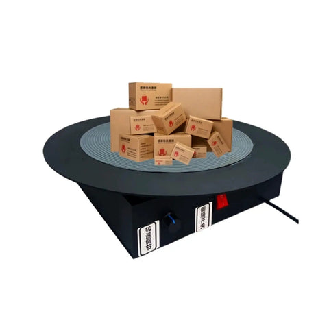 High Efficiency Electric Strapping Machine With Rotary Turntable For Carton Sealing and Tape Winding with stacked boxes on platform.