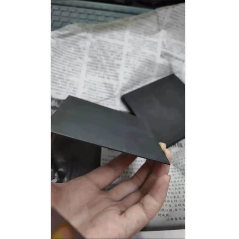 Hand holding Ultra Pure Graphite Plate Block Sheet Pro Grade 99.99 Percent High Purity Electrode Grade Graphite 3x100x100 mm