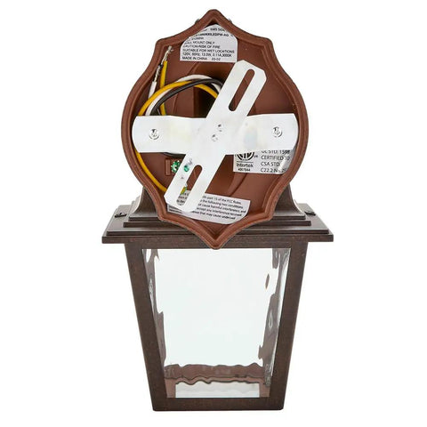 Back view of LED Porch Lantern Outdoor Wall Light In Aged Bronze With Clear Water Glass, 875 lumens, dusk-to-dawn sensor revealed.